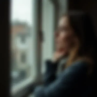 Reflecting on Relationship Dynamics A person looking thoughtfully out of a window, deep in contemplation