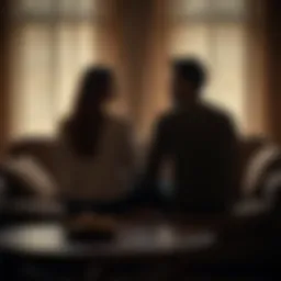 A couple sitting apart on a couch, looking distant